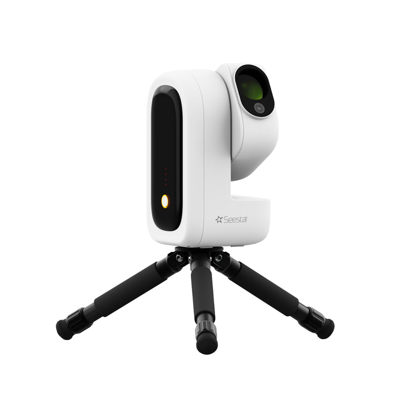 Seestar smart robotic telescope on a tripod for astrophotography.
