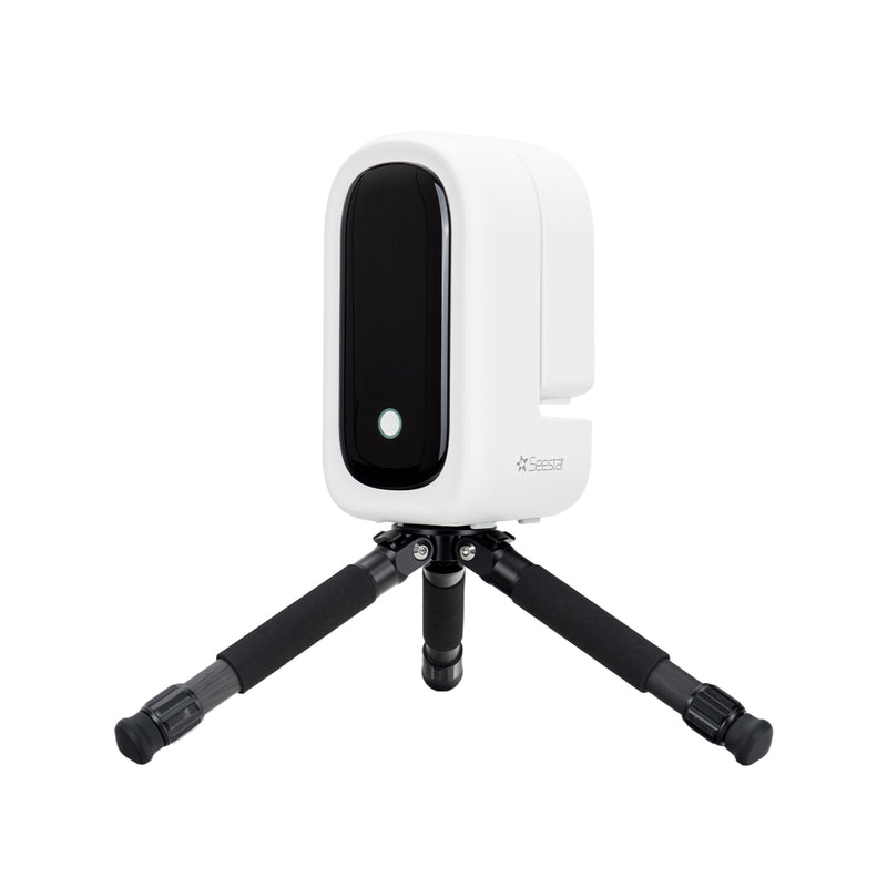 Seestar smart telescope and tripod for astrophotography on a white background